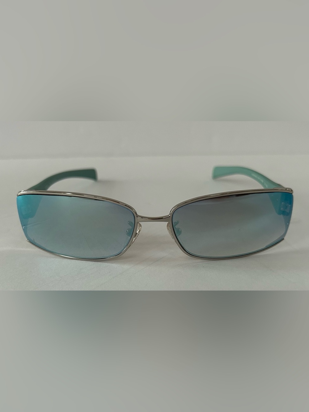 Furla Silver Frame Sunglasses with Blue Lenses and Teal Temples